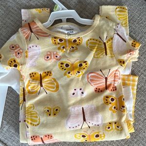 Two sets of pajamas short sleeve. One pair with shorts one with pants. Carters